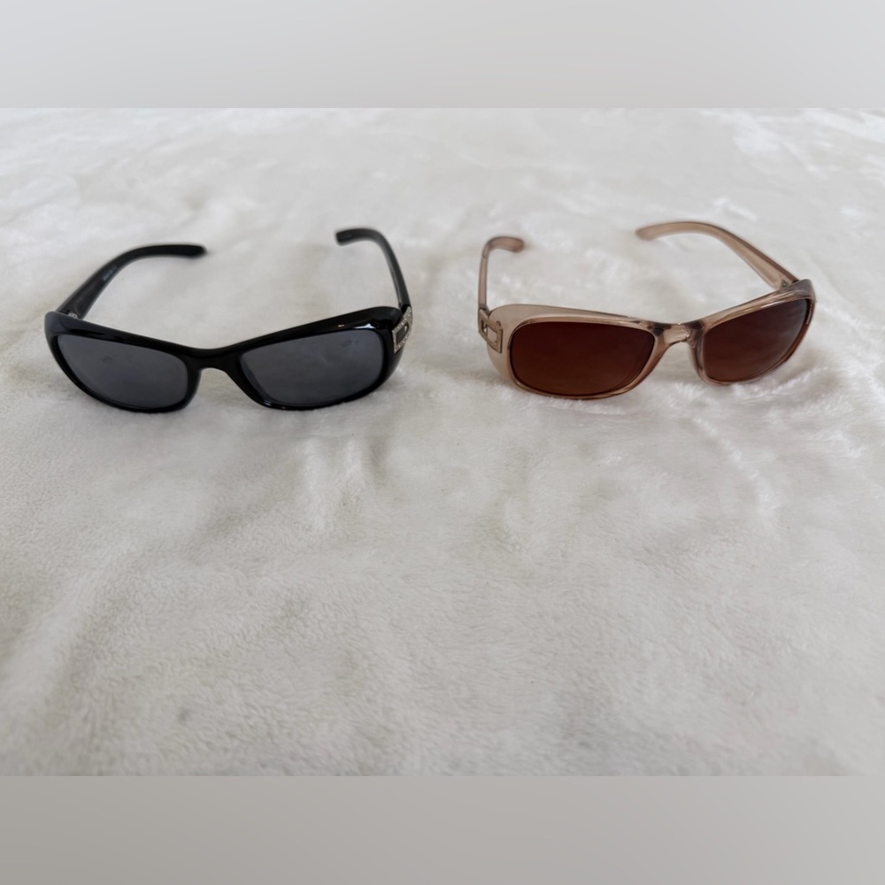 2 Pair Sunglasses.  Unknown brands.  One black w/ silver accent. One tan w/ gold